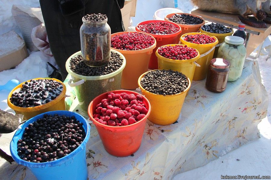 A market near the central scene of the celebration. They sold clothes of fur and leather, berries, n...