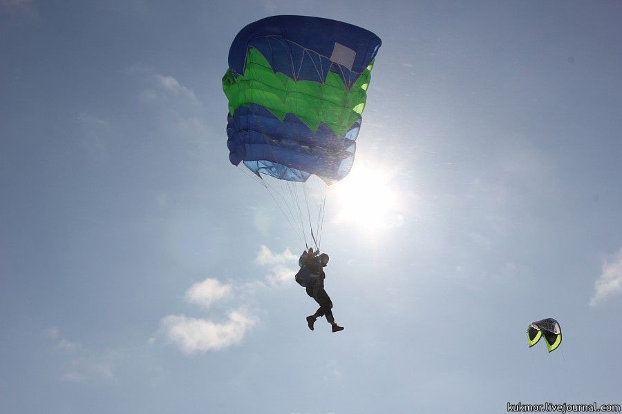 A beautiful soaring of skydivers.